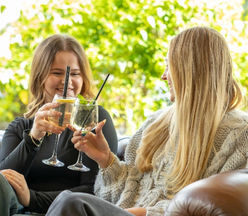 Friends enjoying cocktails and live music at the final stop